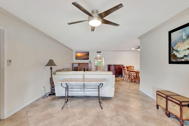 tiled bedroom featuring ceiling fan and crown molding