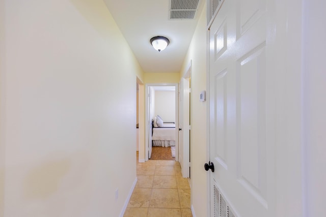 corridor with light tile patterned floors