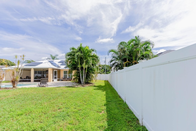 view of yard featuring a fenced in pool and a patio area