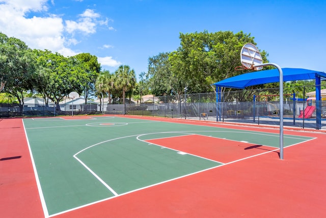 view of sport court with a playground