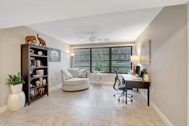 office space with ceiling fan, light tile patterned floors, and a textured ceiling