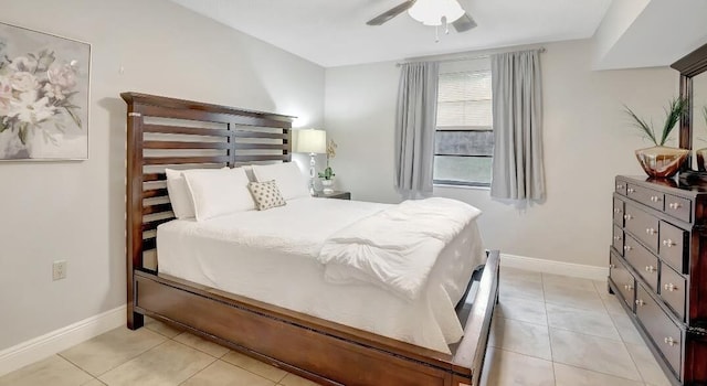 tiled bedroom with ceiling fan