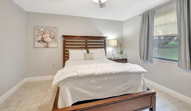 tiled bedroom with multiple windows and ceiling fan