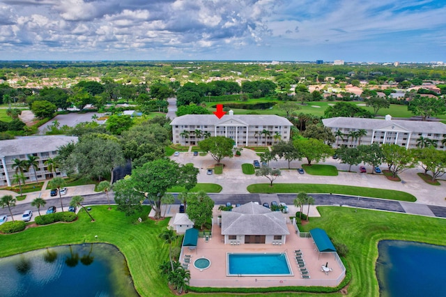 birds eye view of property with a water view