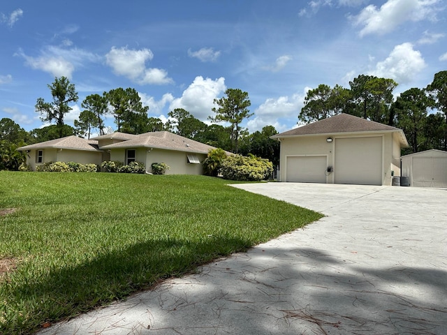 single story home with a garage and a front yard