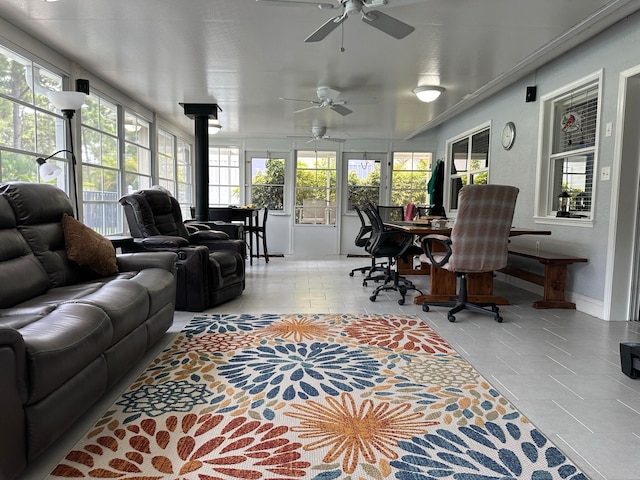 sunroom with ceiling fan