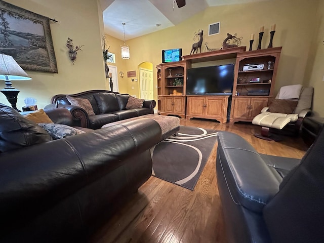 living room featuring lofted ceiling, ceiling fan, and hardwood / wood-style flooring