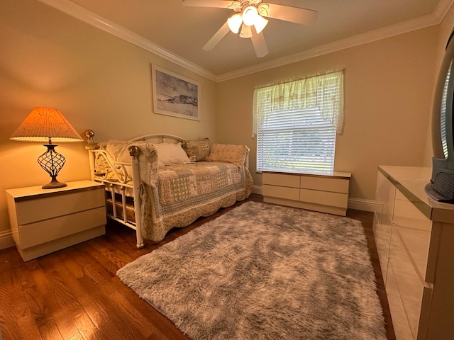 bedroom with ornamental molding, ceiling fan, and dark hardwood / wood-style floors