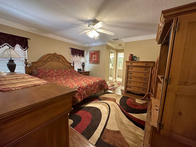 bedroom featuring crown molding, a textured ceiling, ensuite bathroom, and ceiling fan