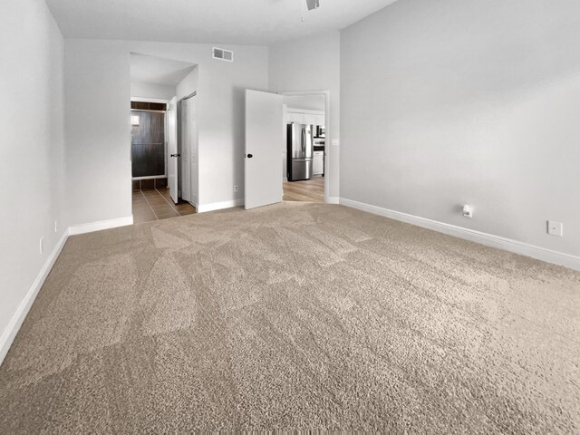 interior space with lofted ceiling and ceiling fan