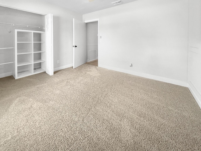 unfurnished bedroom featuring visible vents, baseboards, and carpet floors