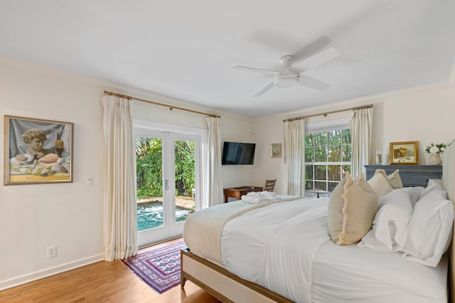 bedroom with light hardwood / wood-style floors, multiple windows, access to exterior, and ceiling fan