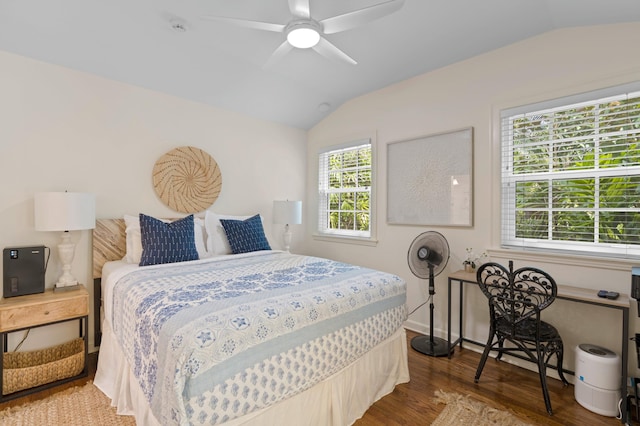 bedroom with lofted ceiling, ceiling fan, and hardwood / wood-style floors