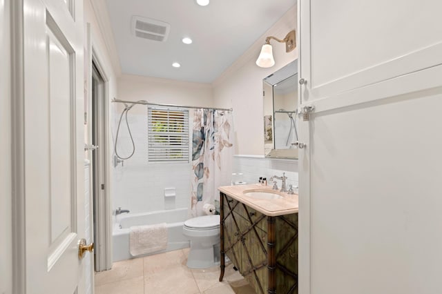 full bathroom featuring tile patterned floors, crown molding, shower / tub combo with curtain, vanity, and toilet