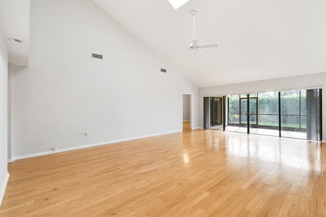 spare room featuring high vaulted ceiling, light hardwood / wood-style flooring, and ceiling fan