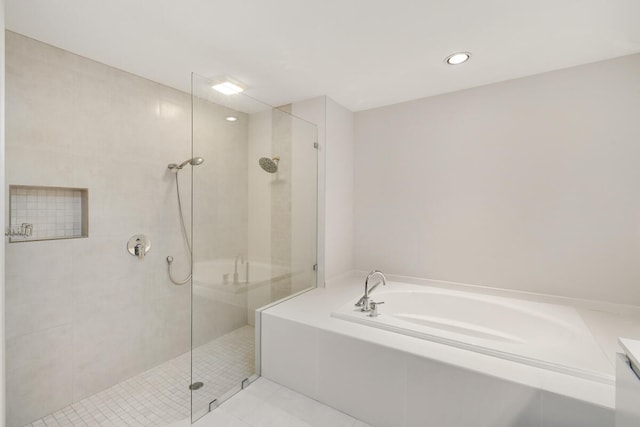 bathroom with plus walk in shower and tile patterned flooring