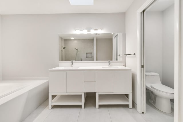 full bathroom with separate shower and tub, toilet, vanity, and tile patterned floors