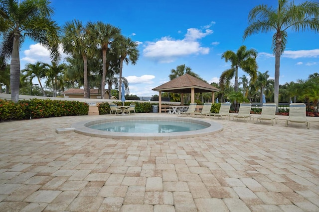 view of swimming pool with a gazebo and a patio