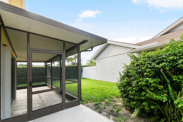 view of patio with a sunroom