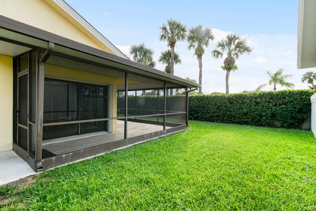 view of yard featuring a sunroom