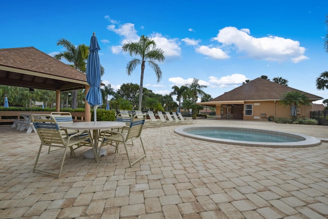 view of swimming pool with a patio area and a gazebo