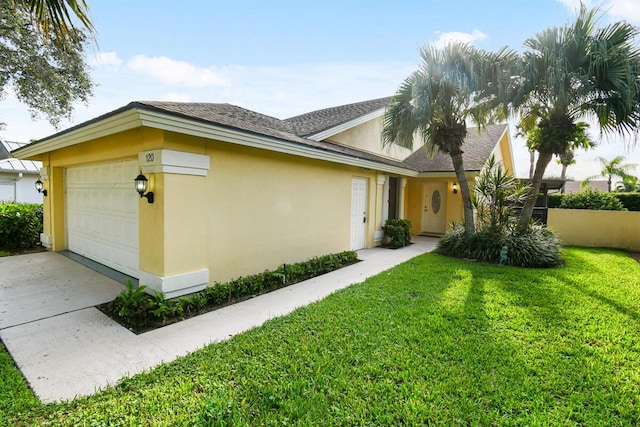 ranch-style home with a garage and a front yard