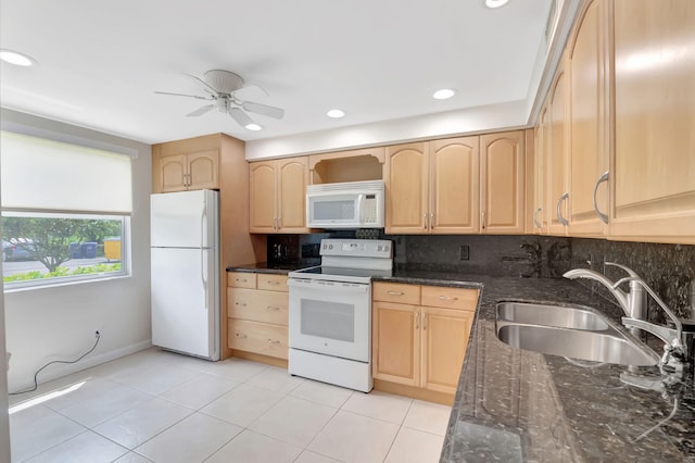 kitchen with white appliances, light brown cabinets, sink, and ceiling fan