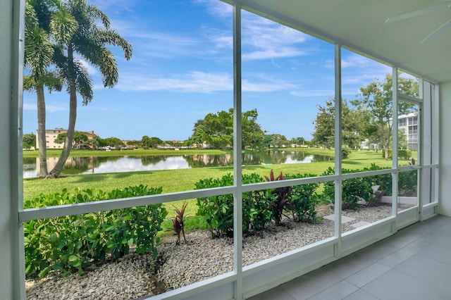 unfurnished sunroom with a water view