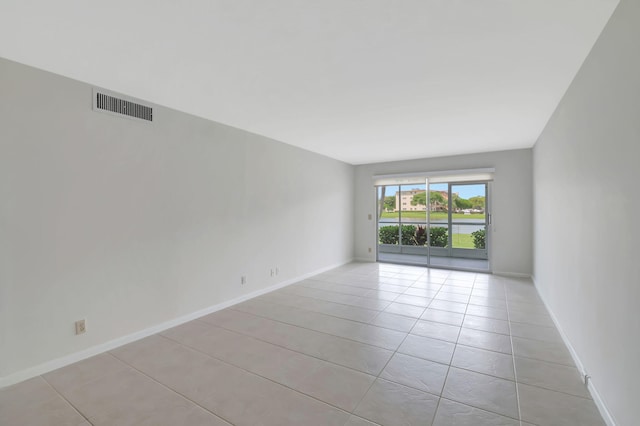 empty room featuring light tile patterned floors