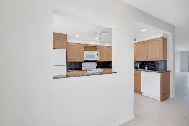 kitchen featuring light tile patterned floors, white appliances, light brown cabinets, ceiling fan, and decorative backsplash