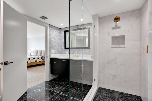 bathroom with vanity and an enclosed shower