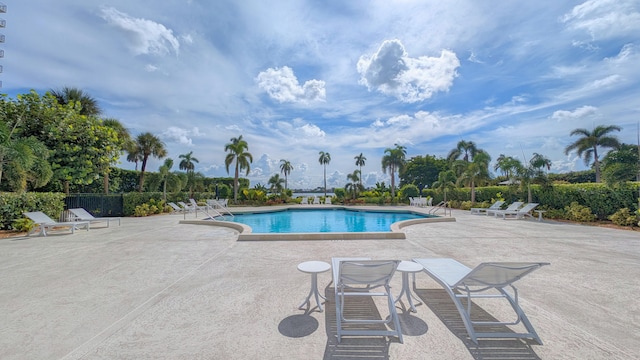 view of swimming pool with a patio