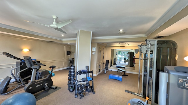 gym with ornamental molding, ceiling fan, and carpet floors