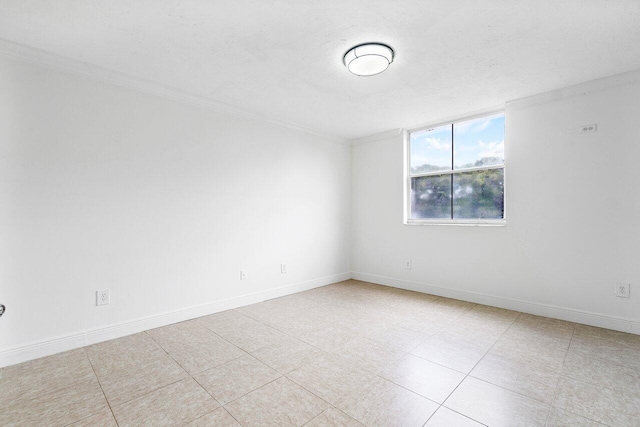 empty room with a textured ceiling and ornamental molding