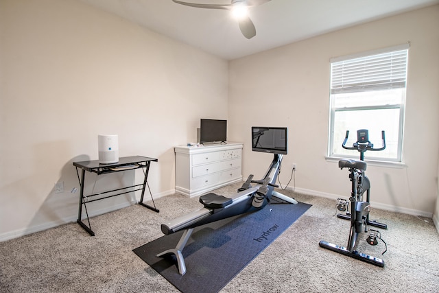 exercise area with ceiling fan and light carpet