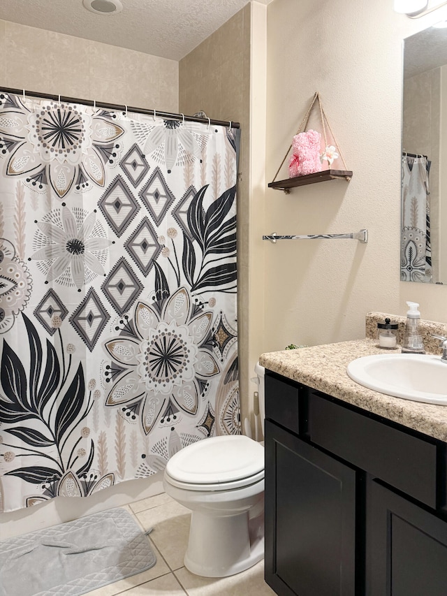 bathroom with a shower with shower curtain, toilet, a textured ceiling, and vanity