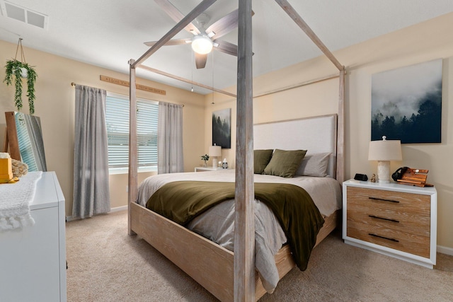 bedroom featuring ceiling fan and light carpet