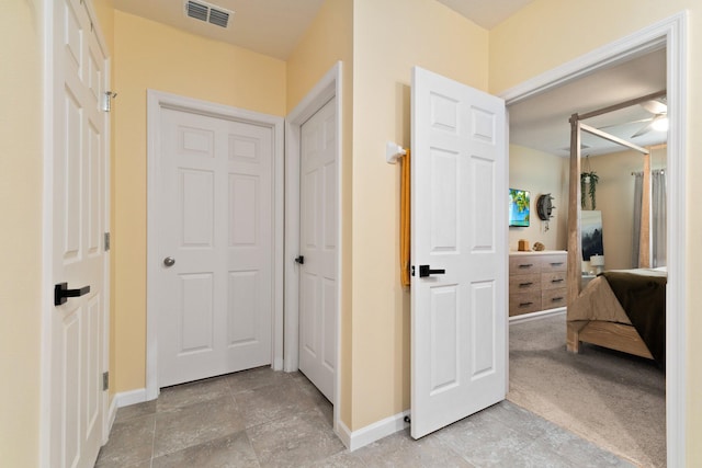 hallway featuring light carpet