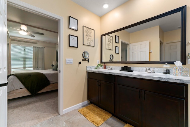 bathroom featuring tile patterned floors, ceiling fan, and vanity