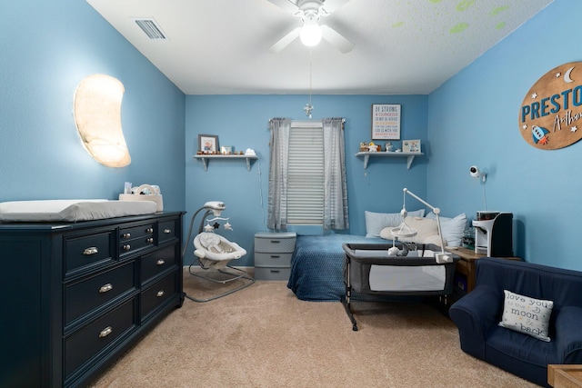 bedroom with light carpet and ceiling fan