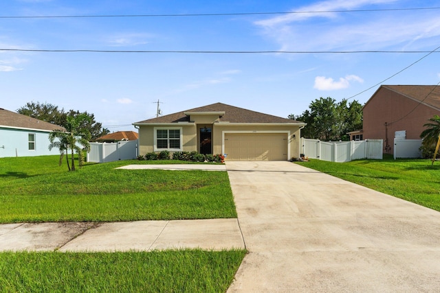 view of front of property with a garage and a front yard