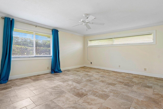 empty room with ceiling fan, a textured ceiling, and crown molding