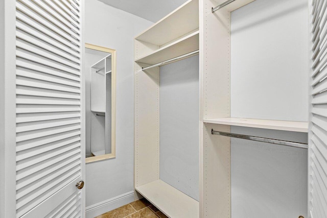 spacious closet featuring tile patterned floors