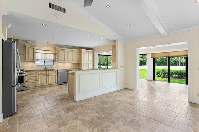 kitchen featuring light brown cabinets, sink, kitchen peninsula, appliances with stainless steel finishes, and light stone countertops