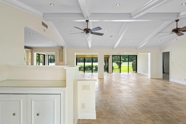 unfurnished living room with ceiling fan, crown molding, beam ceiling, and a wealth of natural light