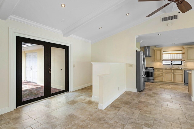 interior space with beam ceiling, ceiling fan, french doors, and sink