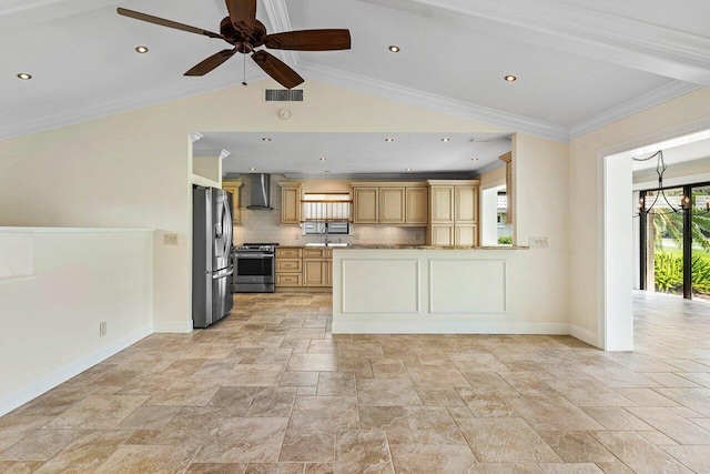 kitchen with appliances with stainless steel finishes, vaulted ceiling, backsplash, wall chimney exhaust hood, and ceiling fan