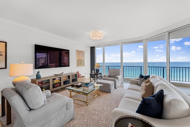 living room featuring a water view, a wall of windows, and ornamental molding