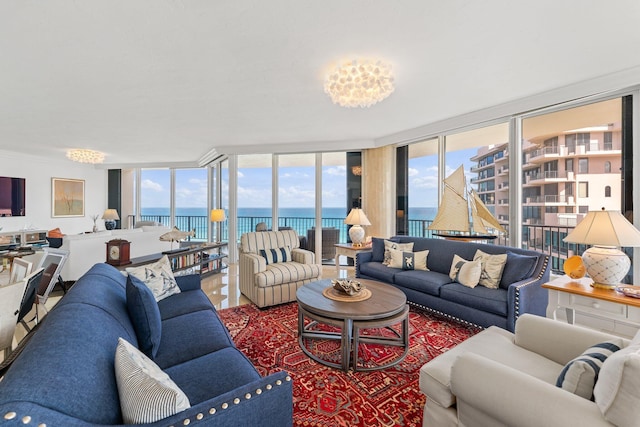 living room with a water view, a wealth of natural light, and floor to ceiling windows