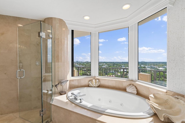 bathroom featuring separate shower and tub